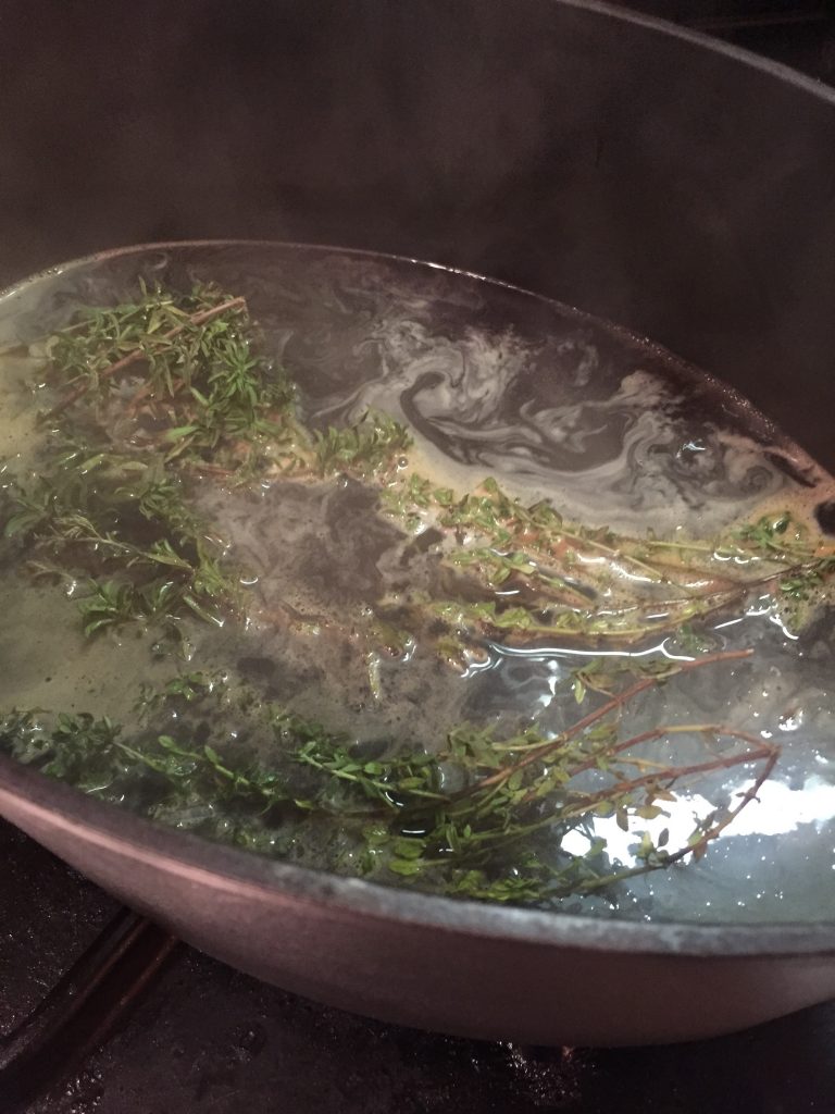 Pot with wine and herbs